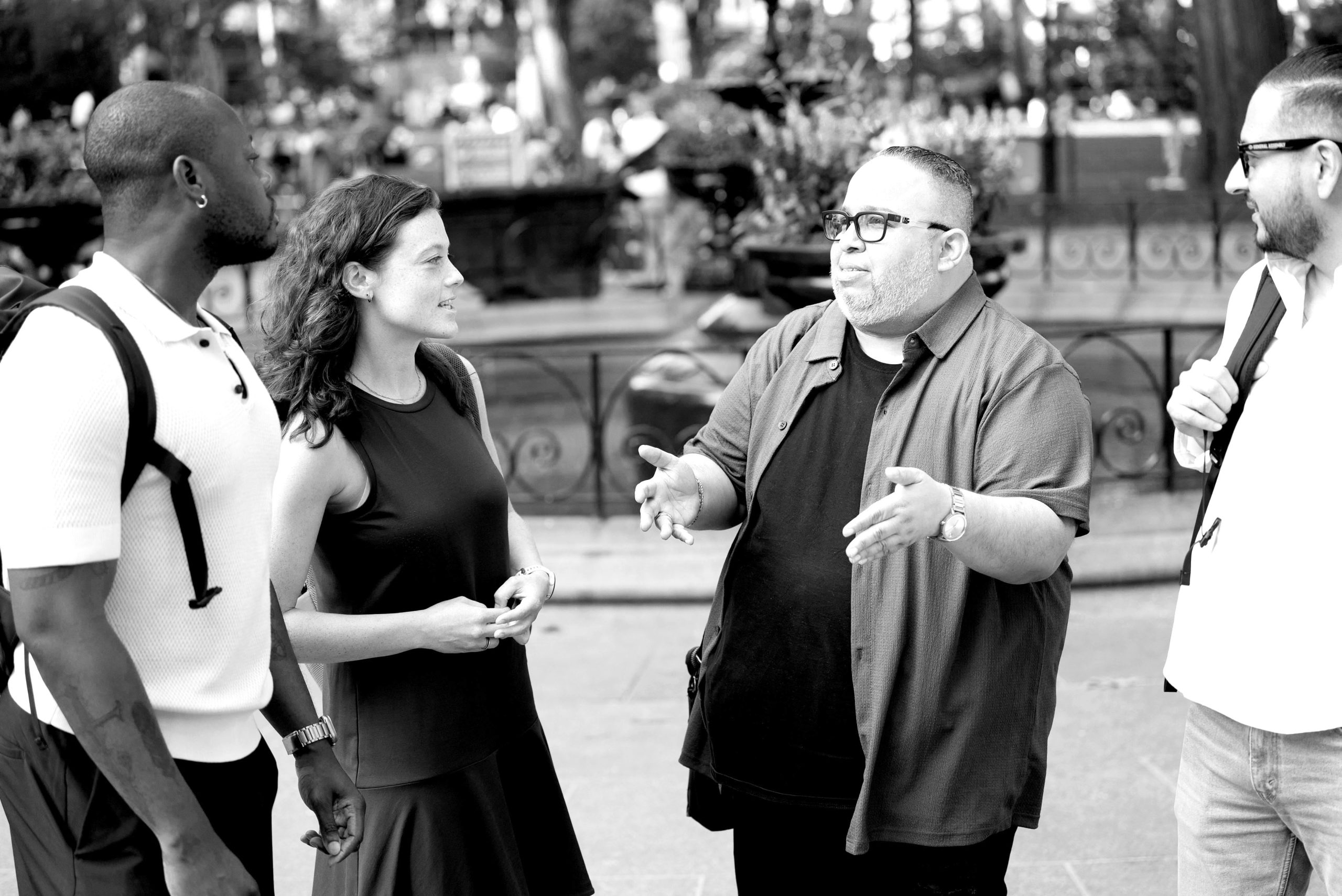 Group of diverse colleagues chatting outside